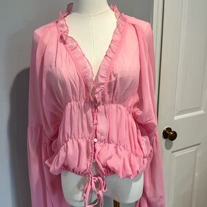 Sndy pink blouse button and tie at bottom ruffles too